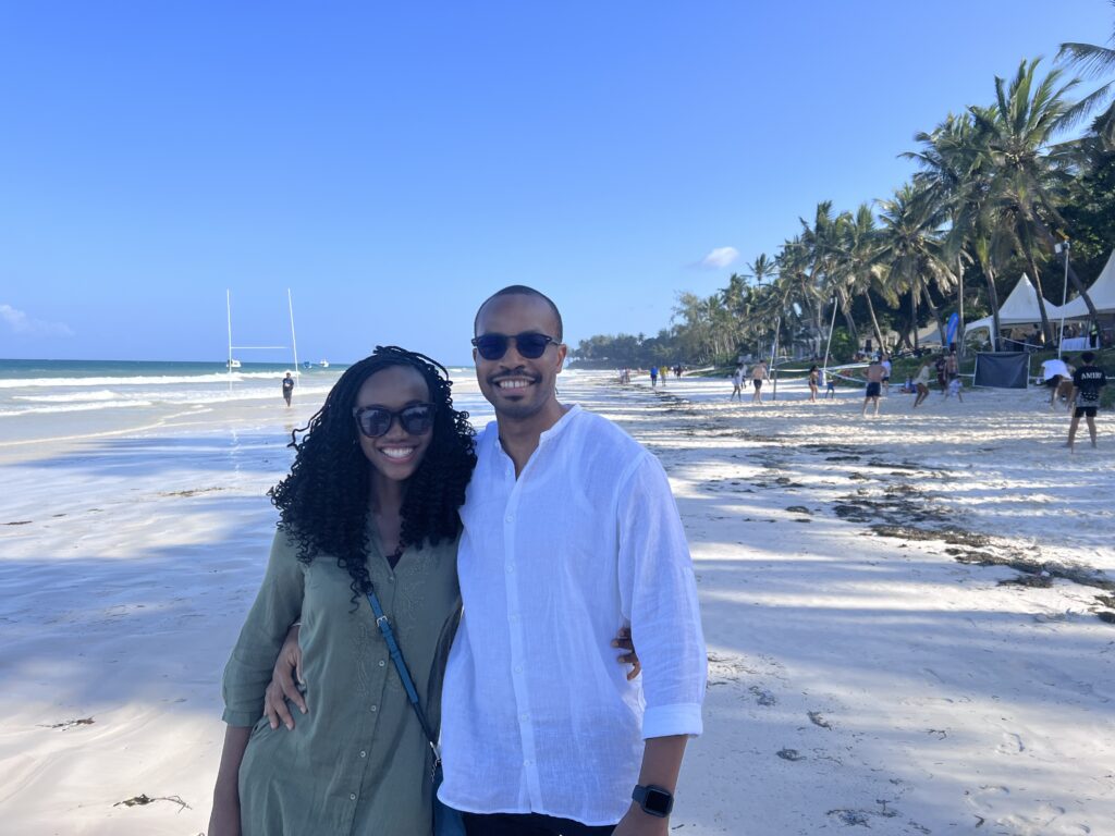 black couple standing on diani beach